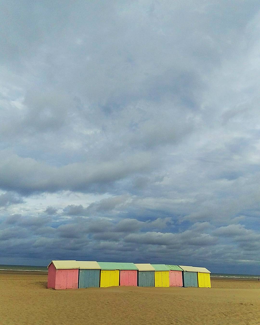 Ran on the beach this morning. #beach #beachhuts #clouds #sky #morning #run #running #france #sea #ocean #sand #summer